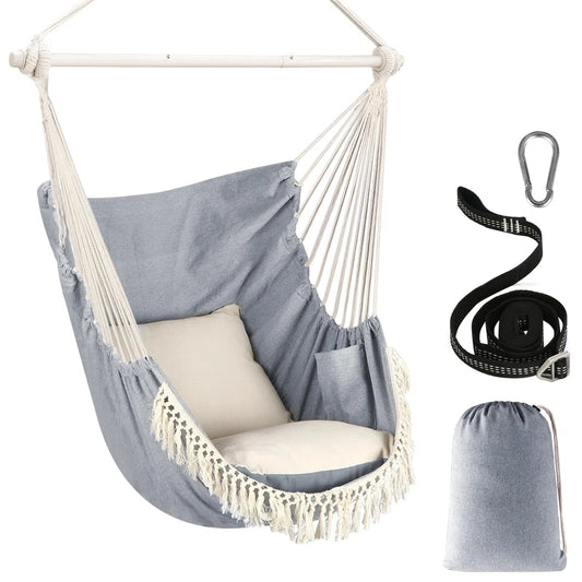 Grey fringed hanging chair with accessories on white background
