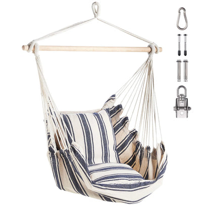 Striped swing chair hanging from tree branch